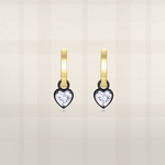 Heart cut lab diamond huggie hoop earrings in yellow gold with black prong setting