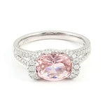 Oval pink lab diamond halo engagement ring in white gold with pavé band