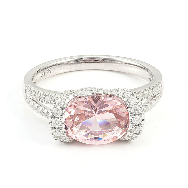 Oval pink lab diamond halo engagement ring in white gold with pavé band