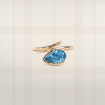 Pear cut blue lab diamond ring in yellow gold with sculptural bypass setting