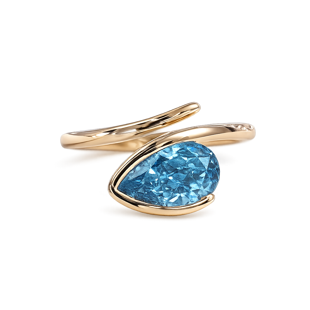 Pear cut blue lab diamond ring in yellow gold with sculptural bypass setting