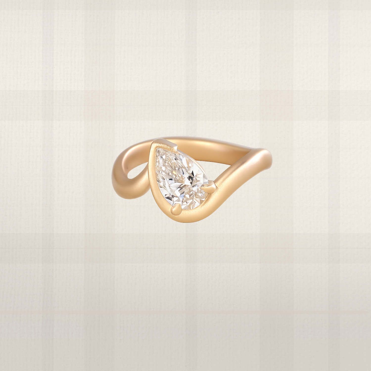 Pear cut lab diamond ring in brushed yellow gold with bypass setting