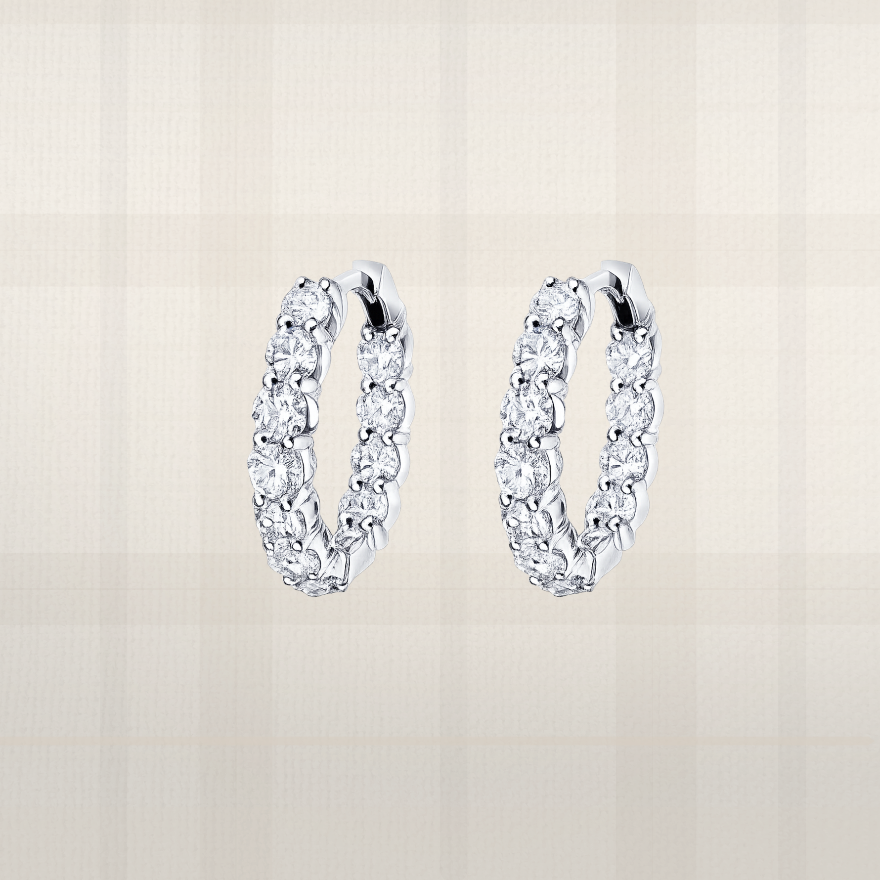 Round brilliant moissanite huggie hoop earrings in sterling silver with luxury lab diamond look