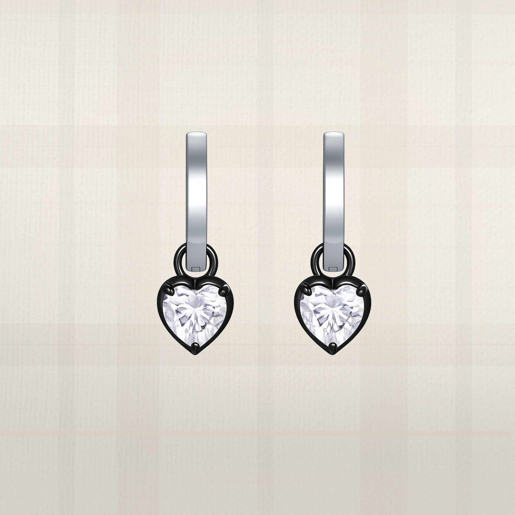 Heart-shaped diamond earrings on a light beige background